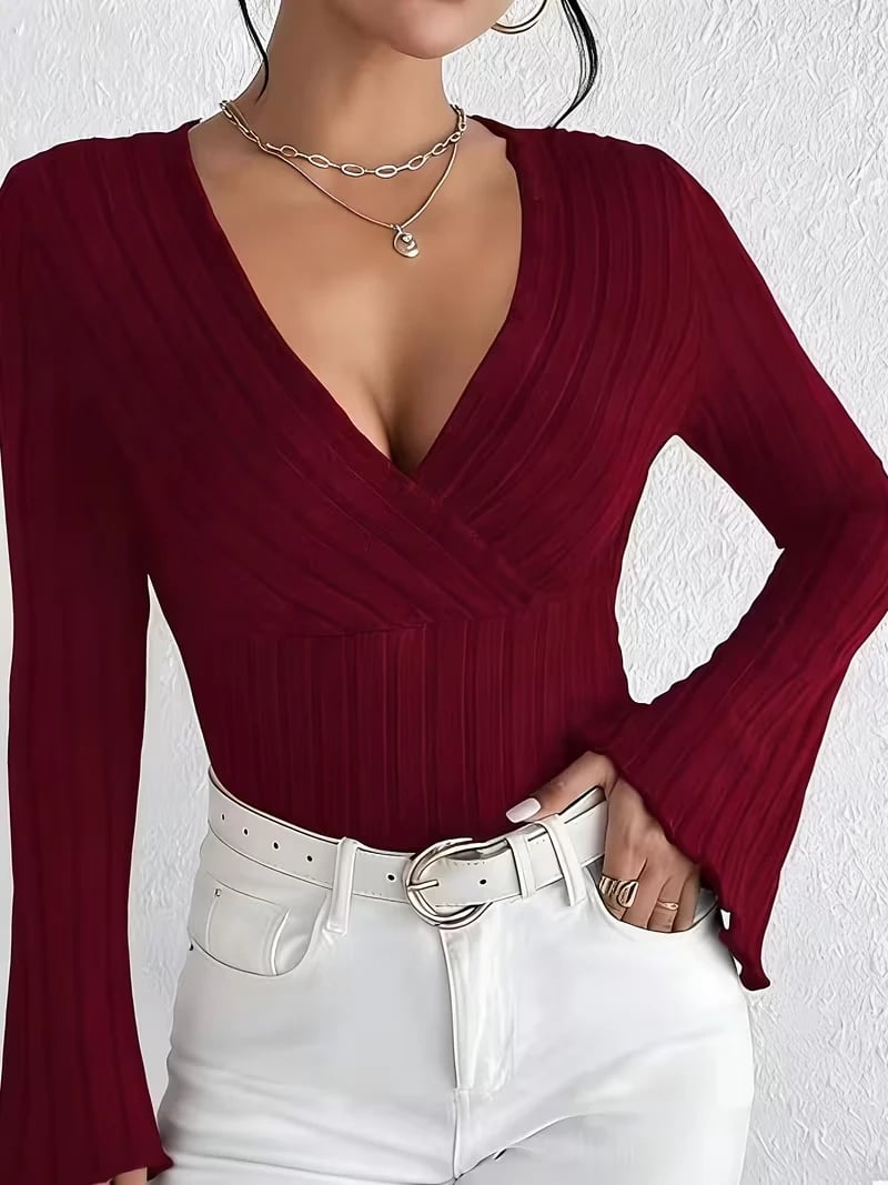 V-Neck Top That Highlights a Perfect Figure. Flared Sleeves